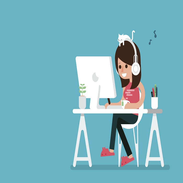 Happy woman working on computer.